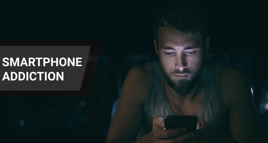 man looking at mobile phone screen.