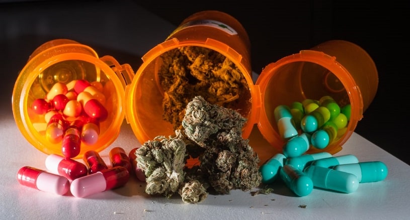 Cannabis and Xanax pills in bottles.