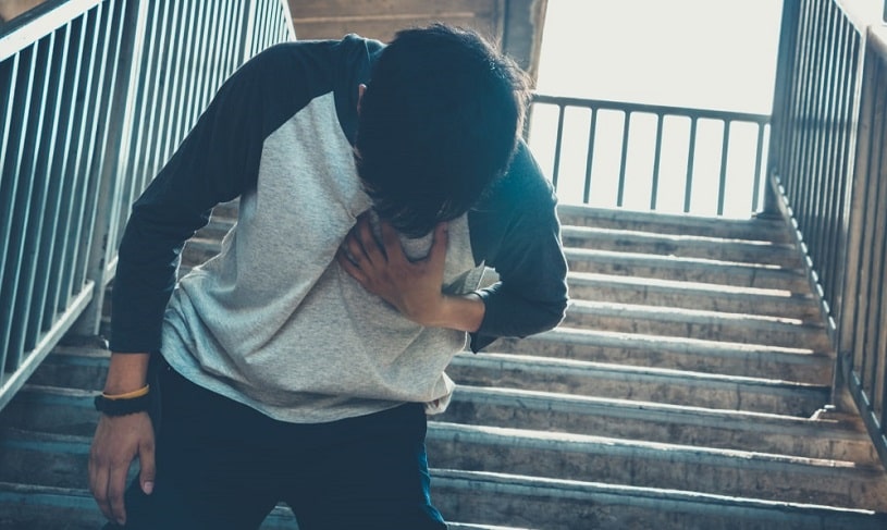 Man having a heart attack from a crack overdose.
