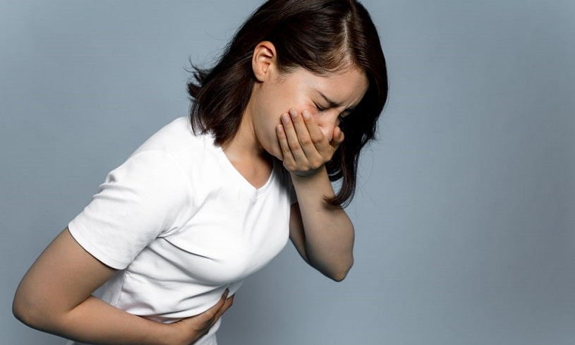 Woman suffering nausea from Percocet withdrawal.