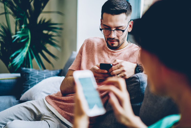 friends using smartphones for social networks.