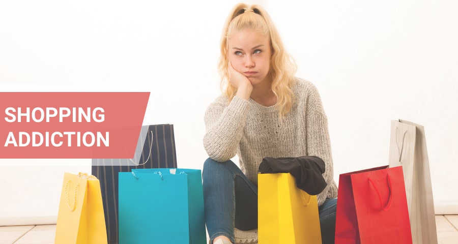 Sad woman with shopping bags.
