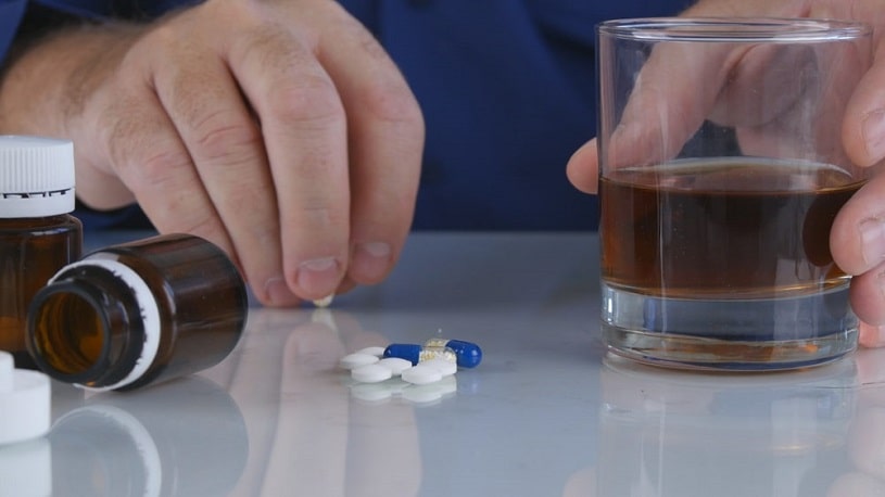 Man taking hydrocodone with alcohol.