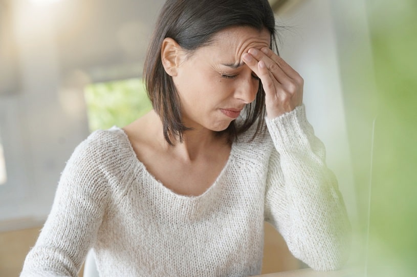 Woman suffering from hydrocodone side effects.