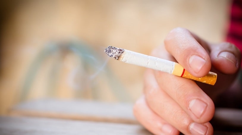Cigarette in a hand.