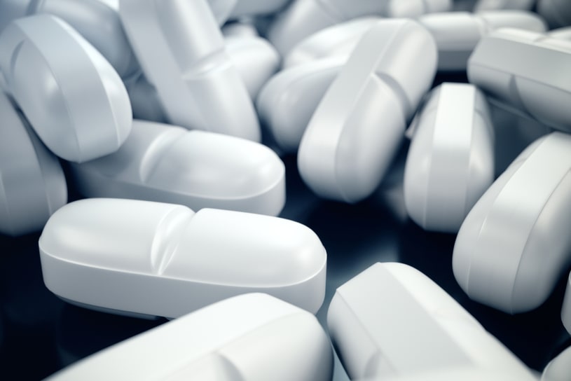 Ambien white pills close up.