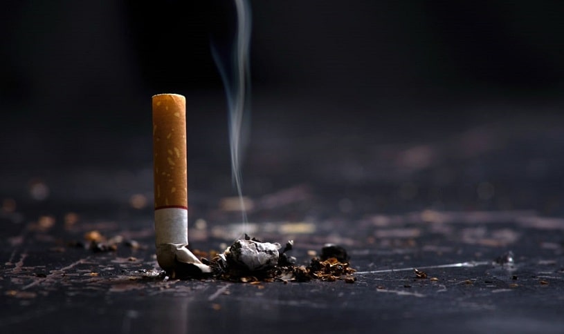 Cigarette but on the floor.