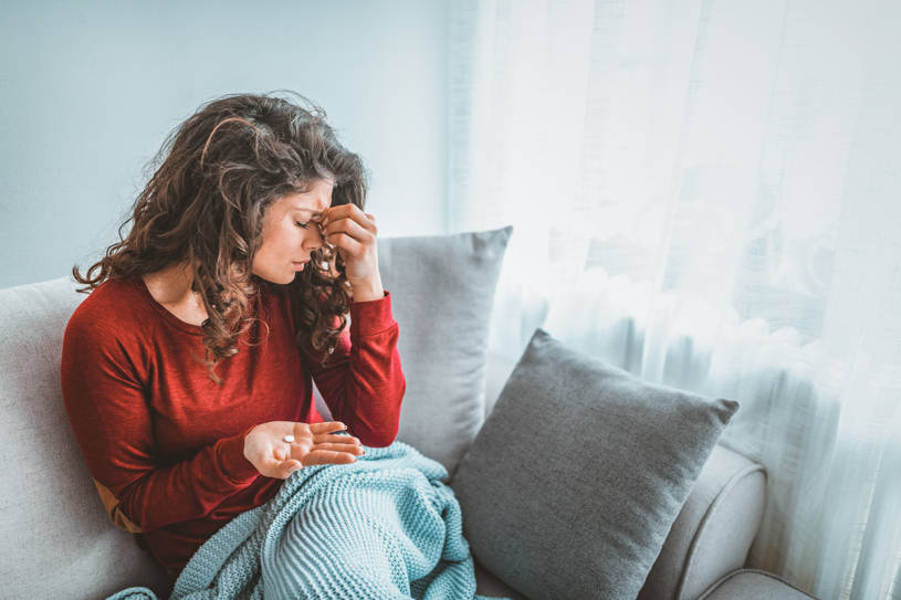 A woman with a headache.