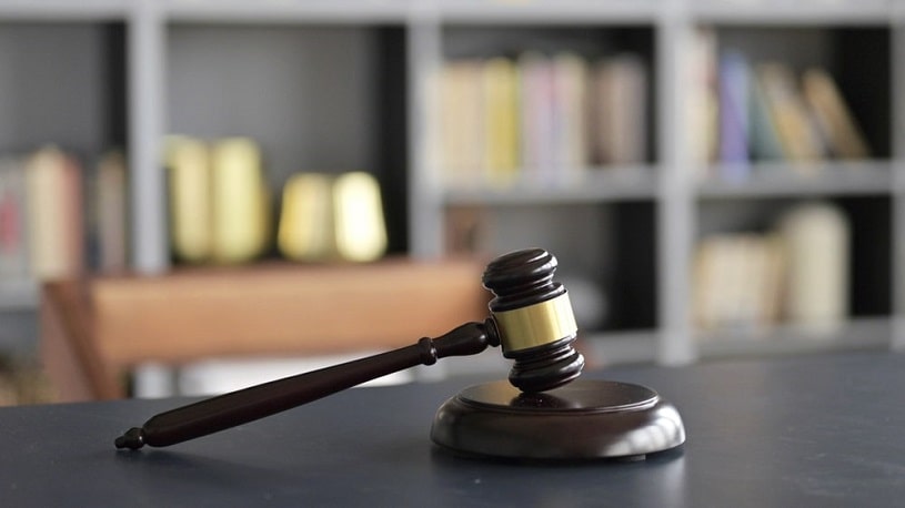 Gavel on court room table.
