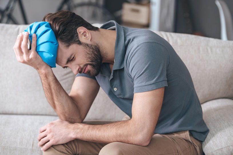 Man feeling terrible hangover headache.