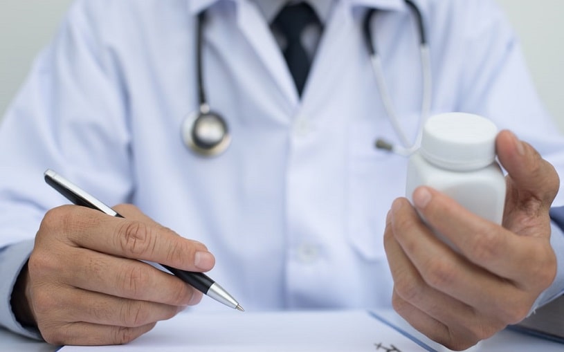 Doctor writing a prescription.