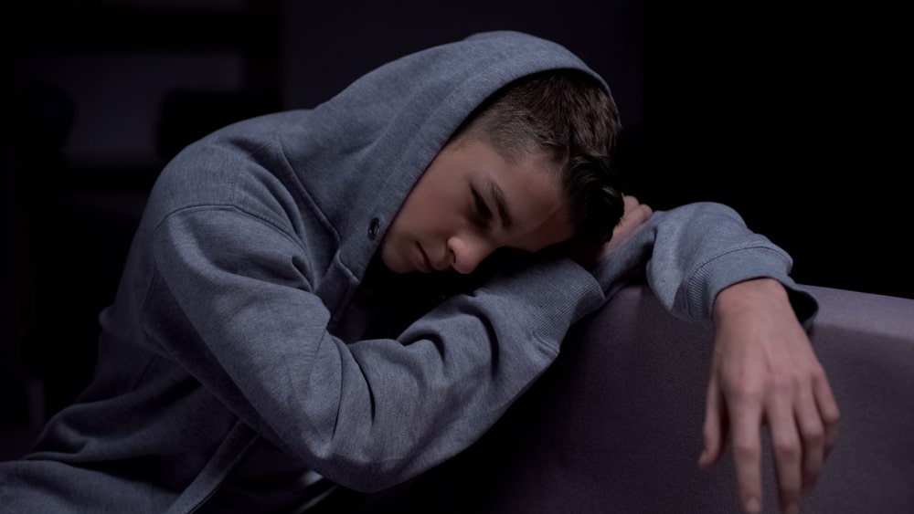 Addicted young man suffering from Prozac withdrawal.