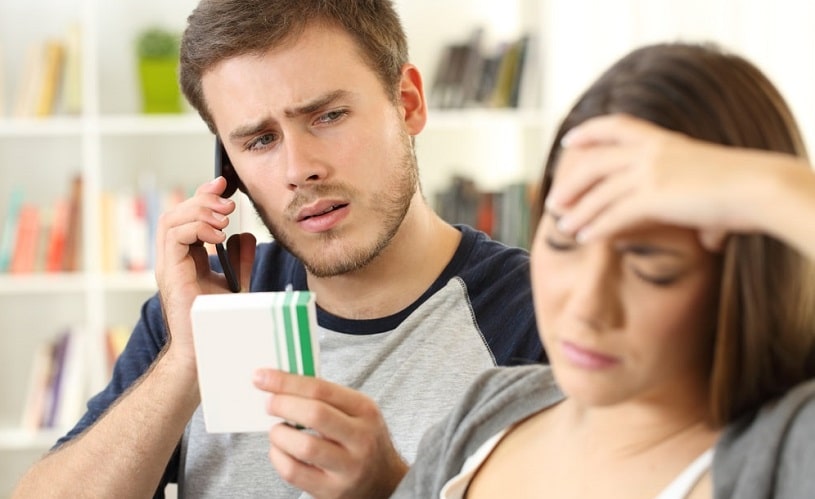Husband reading the indications and side effects of Effexor.