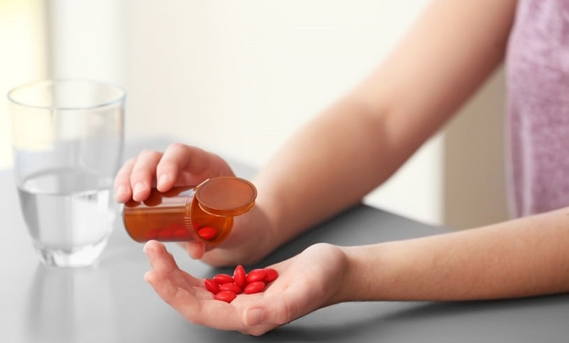 Woman taking too much Prozac pills.