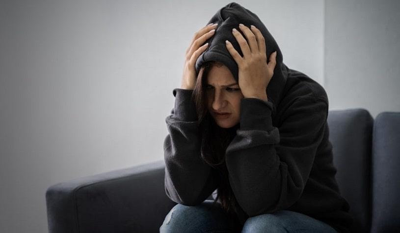 Woman suffering from tramadol withdrawal, feeling bad.