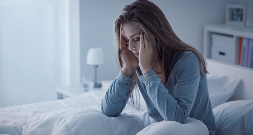 Woman on the bad with signs of Valium abuse.