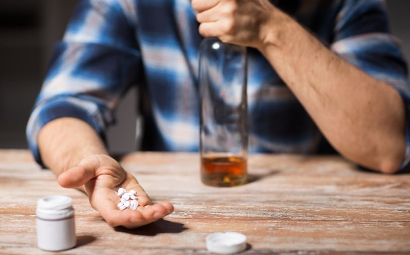 Man drinking alcohol and Prozac medication.