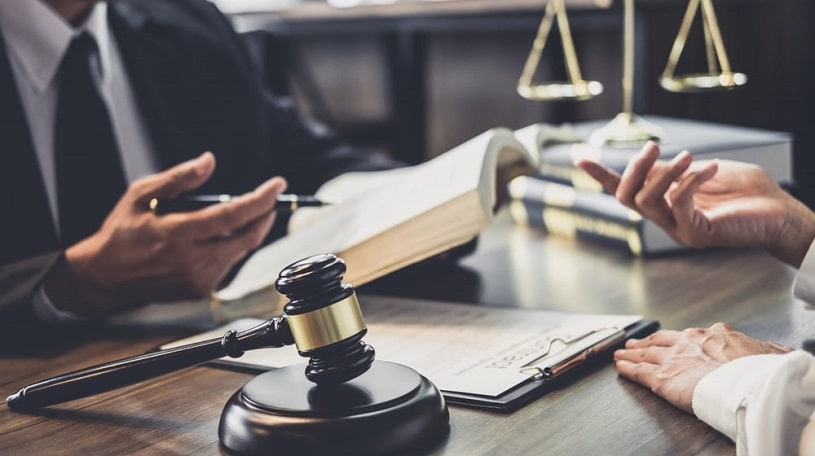 A lawyer with documents discussing Kratom ban in the US.