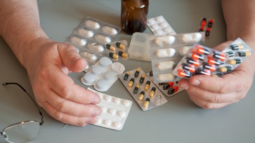 Pristiq and Effexor pills and other pills on the table.