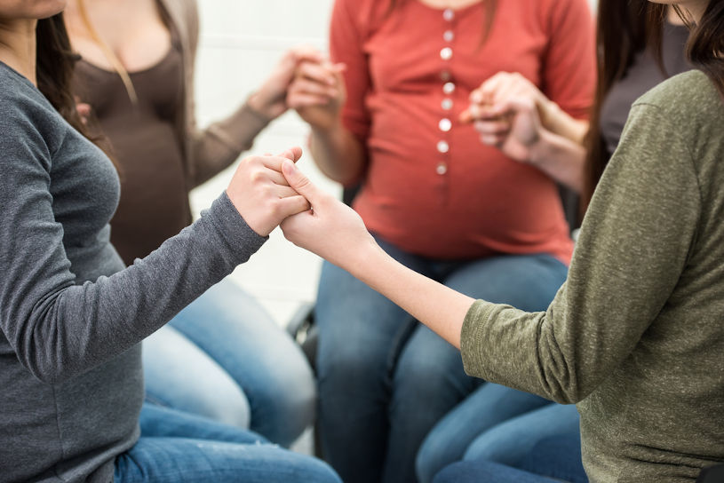 pregnant women together.