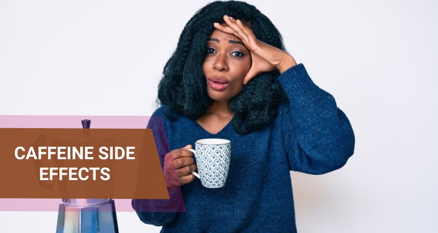 Woman holding a cup of coffee experiencing headache.