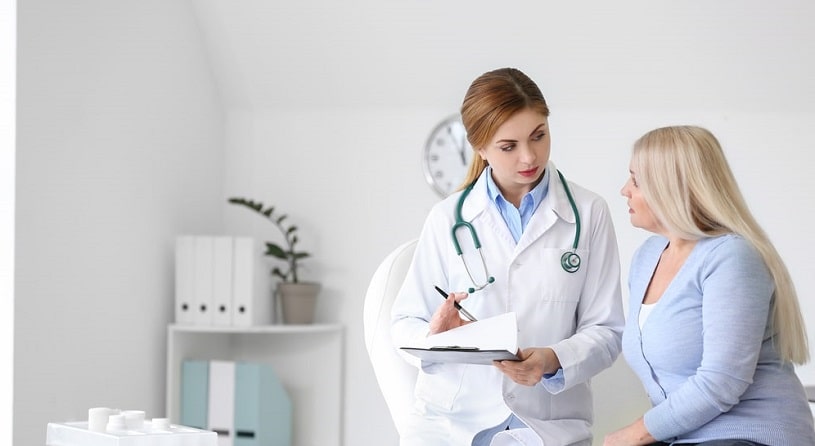 Woman consulting a patient about stopping Baclofen.