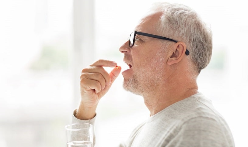 Old man taking methadone for opioid addiction.
