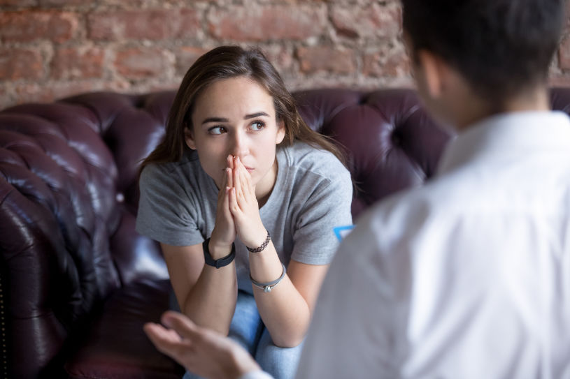 A woman in depression talks to her doctor about addiction.