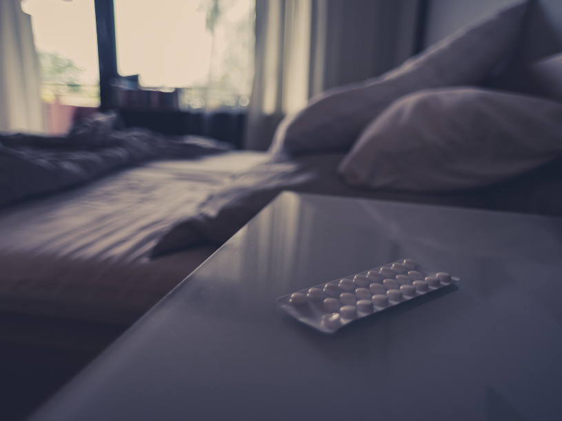Amitriptyline pills lie on the table.