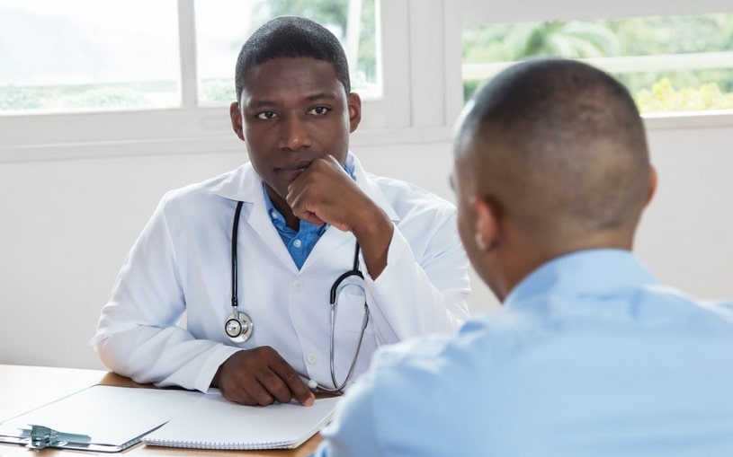 Doctor listening to his patient.