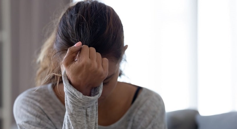Woman feeling depressed after taking Soma.