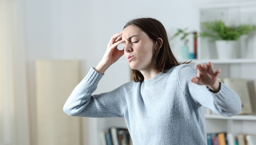 Woman feeling dizzy after taking Soma alcohol mix.