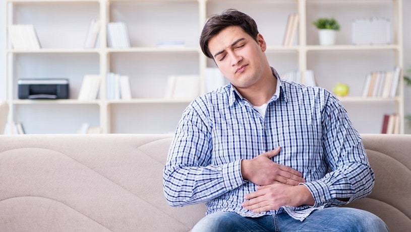 Man suffering from side effects of taking oxycodone and alcohol together.