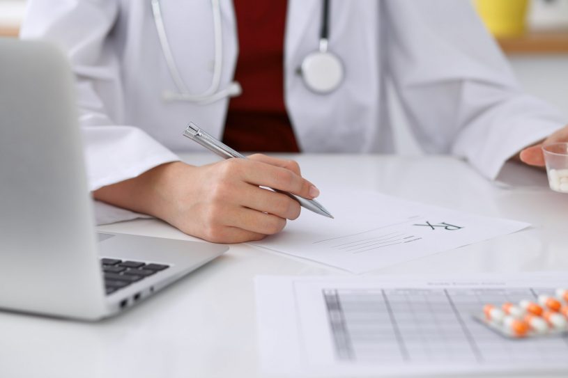 Doctor helps patient with Naloxone Prescription.