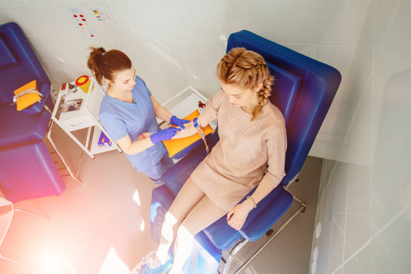 Woman takes blood test for a drug court.