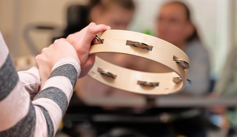 Patients having music therapy in a group.