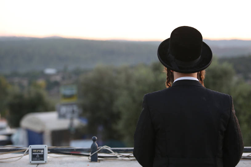 Addicted Jewish man meditates in prayer.