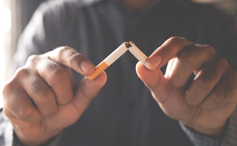 Man breaking the cigarette, refuses smoking.