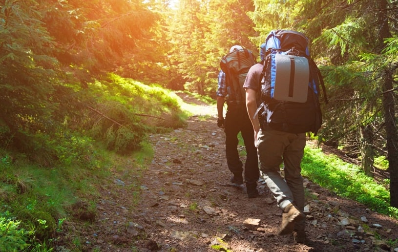 Two friends travelling in the mountains.
