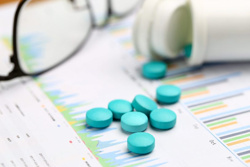 Blue tablets and white bottle