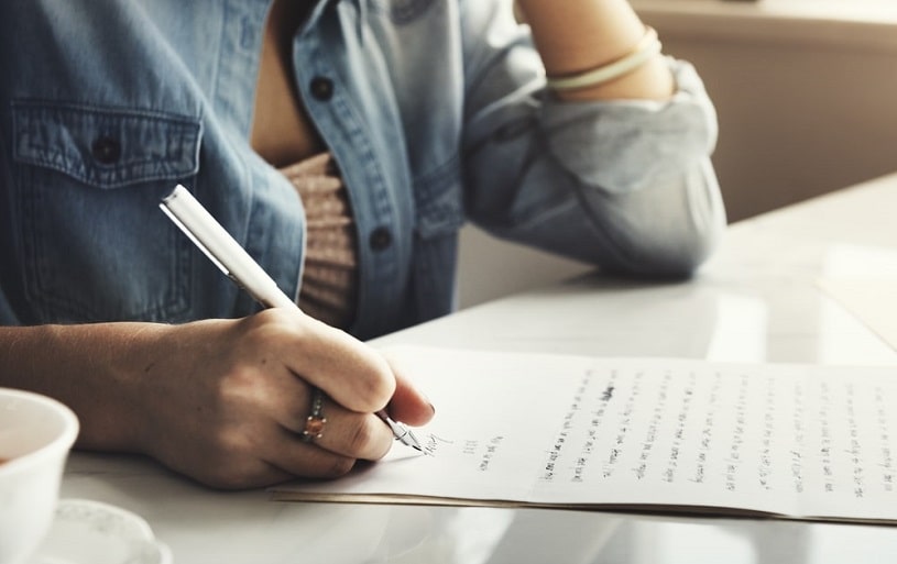 Girl writing an intervention letter.