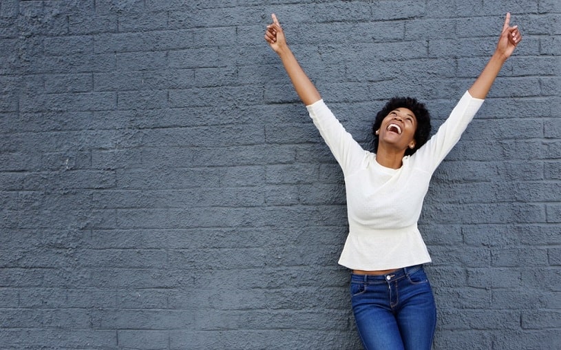 Very cheerful woman experiencing a pink cloud syndrome.