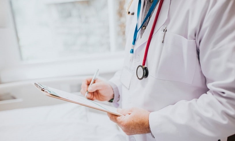 Doctor writing something.