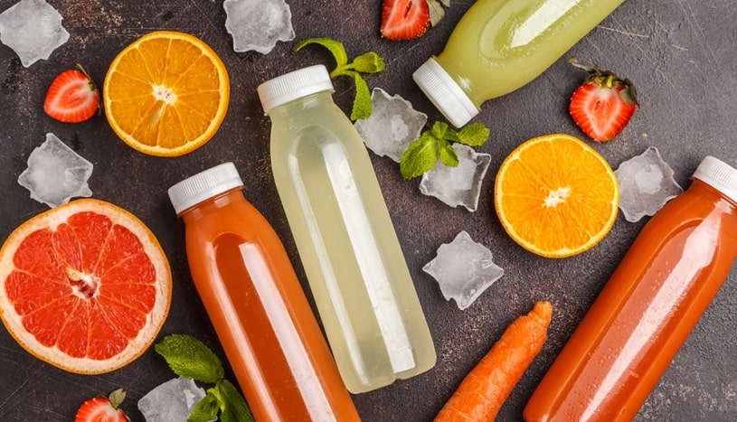 Variety of smoothies in bottles made at home.