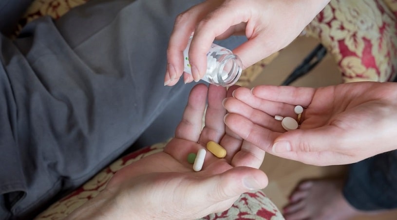 Doctor giving detox medications to a patient.