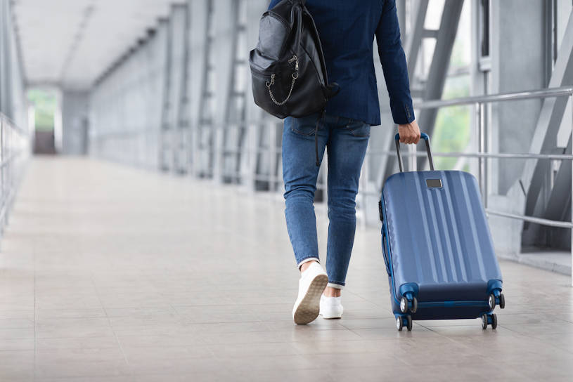 Man traveling for rehab With Suitcase.