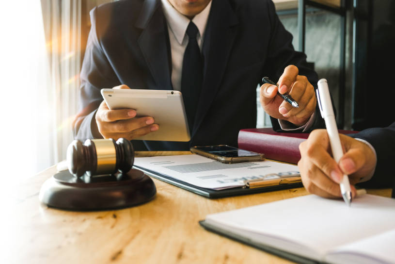 lawyers discussing employee rehab options