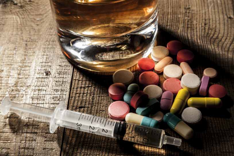 Alcohol and some pills on the table.