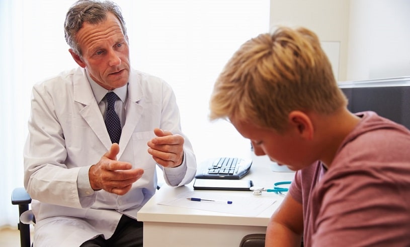 Doctor talking to a teenage addict.
