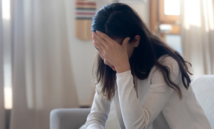 Depressed young woman worried about bullying.